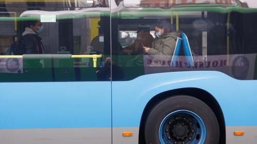 People wearing facemasks on a bus in Madrid
