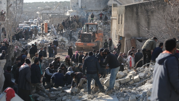 People search for survivors after buildings collapsed in Aleppo