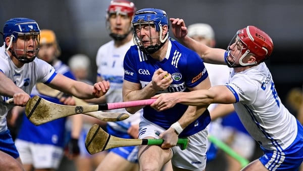 Stephen Maher of Laois in action against Conor Prunty, left, and Calum Lyons of Waterford