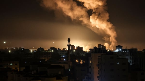 Fire and smoke rise above buildings in Gaza City as Israel launched air strikes on the Palestinian enclave