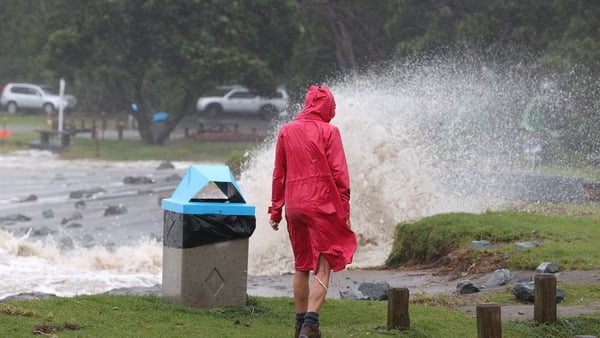 People out looking at the effects of Cyclone Gabrielle at Mathesons Bay Beach in Auckland, New Zealand