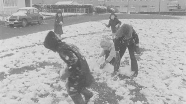 Children play in the snow, in 1973.