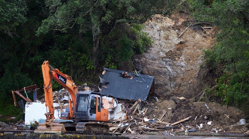 A house in Auckland was flattened by a landslide during the cyclone