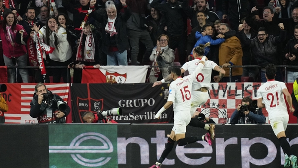 Nemanja Gudelj (C) of Sevilla celebrates his goal against PSV Eindhoven