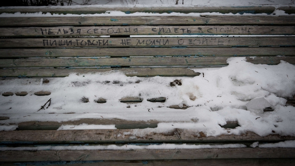 An inscription on a park bench in Moscow reads: 'You can't sit on the sidelines today - write, speak, do not be silent on war!'
