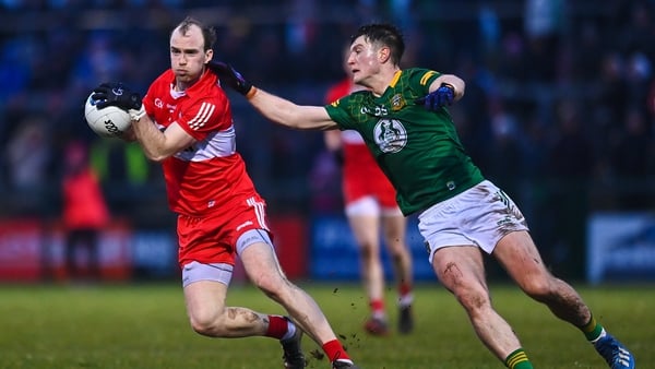 Padraig Cassidy evades Thomas O'Reilly's challenge in Derry's one-sided win over Meath