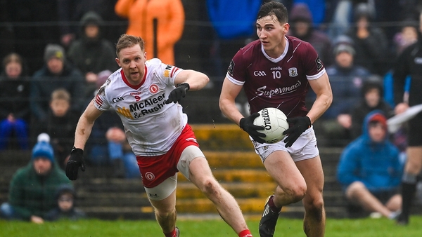 Matthew Tierney in possession with Tyrone's Frank Burns in close quarters