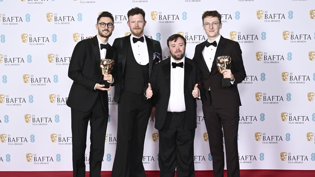 Tom Berkeley, Seamus O'Hara, Pablo Pineda and Ross White pose with the British Short Film Award for 'An Irish Goodbye' during the 2023 EE BAFTA Film Awards
