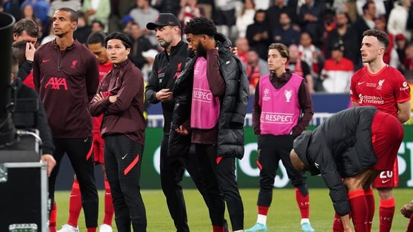 Jurgen Klopp and Liverpool players on the pitch after their Champions League final heartache