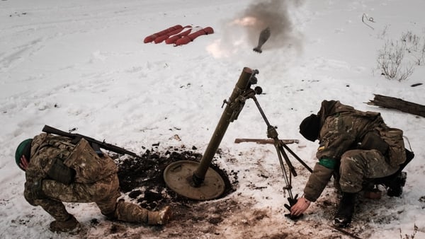 Ukrainian serviceman of the State Border Guard Service fire a mortar toward the Russian position in Bakhmut