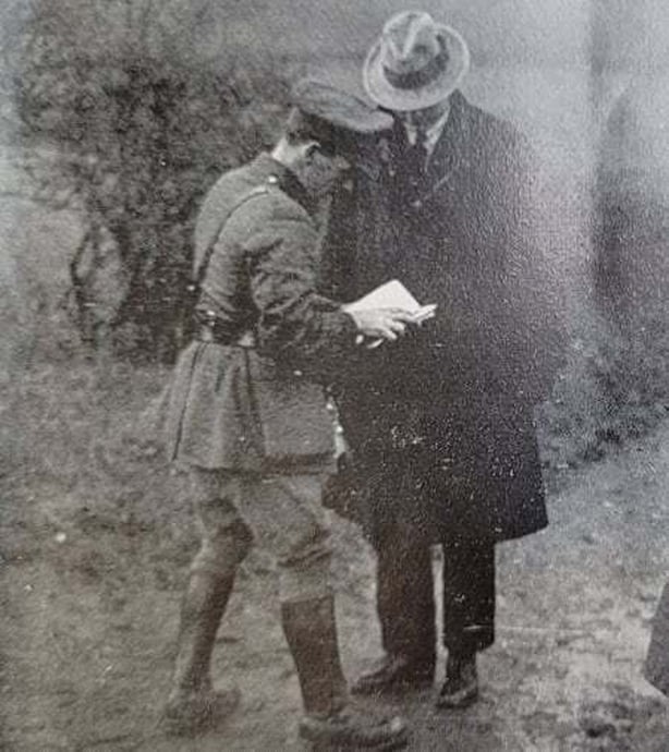 IRA officer examining pedestrian's passport on the border at Clones Photo: Irish Life, 3 March 1922