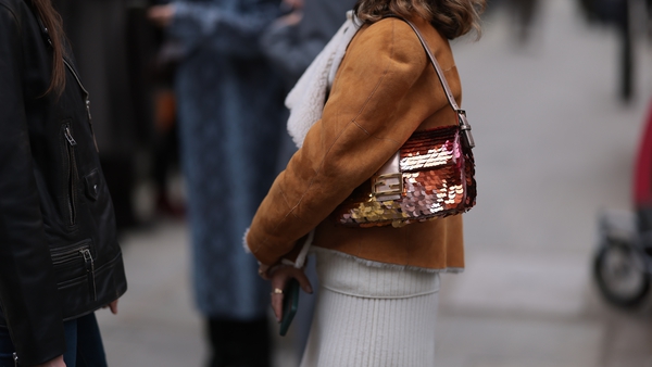 A fashion week guest seen wearing a Fendi sequins baguette during London Fashion Week on February 18, 2023. Getty Images.