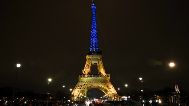 The Eiffel Tower is illuminated in the blue and yellow colours of Ukraine's flag