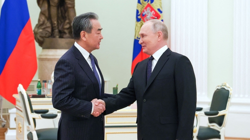 Russian President Vladimir Putin meets with China's Director of the Office of the Central Foreign Affairs Commission Wang Yi at the Kremlin
