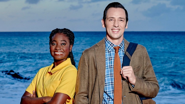 Naomi Thomas as Shantol Jackson and Ralf Little as DI Neville Parker in Death in Paradise