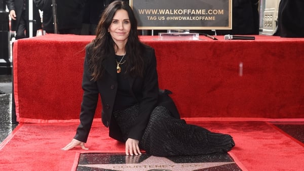 Courteney Cox with her star on the Hollywood Walk of Fame