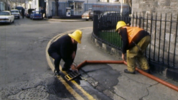 Firefighters tackle a petrol leak on Upper Mount Street, 1978