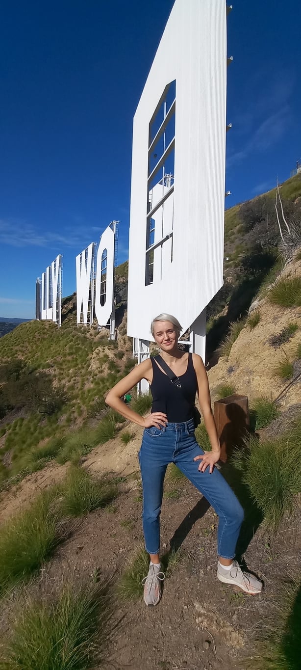 Katie Wright in front of the Hollywood sign during a visit arranged by the Hollywood Sign Trust – access is prohibited for the public (Katie Wright/PA)