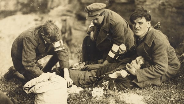 A medic treats a wounded colleague in Kerry (Image: National Library of Ireland)