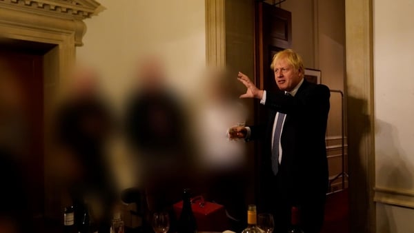 A handout file photo issued by the Cabinet Office shows Boris Johnson at a gathering in 10 Downing Street for the departure of a special adviser