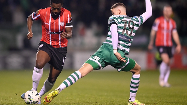 Sadou Diallo of Derry City in action against Markus Poom of Shamrock Rovers
