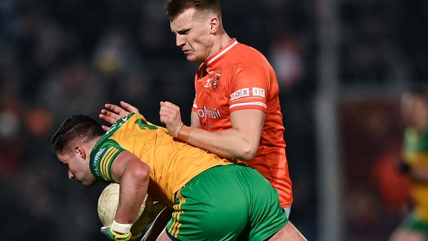 Rían O'Neill tackles Donegal's Brendan McCole