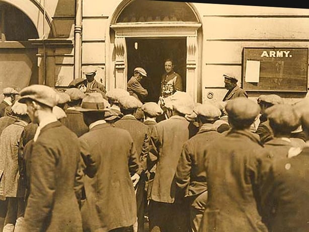 Men entering a stone building