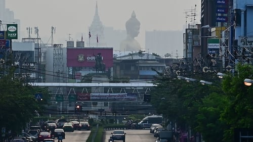 The 69m tall giant Buddha statue of Wat Paknam Phasi Charoen temple is seen amid smoggy conditions in Bangkok