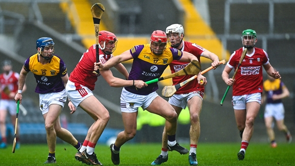 Wexford captain Lee Chin of Wexford is tackled by Ciarán Joyce, left, and Luke Meade