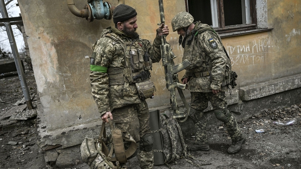Ukrainian servicemen prepare to join the front line near the city of Bakhmut