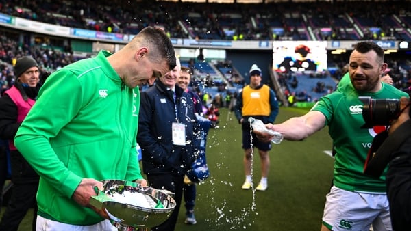 Cian Healy (R) sprays Johnny Sexton with water after Sunday's win in Edinburgh