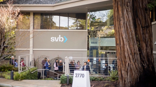People wait for service outside Silicon Valley Bank in Menlo Park, California