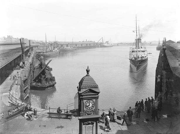 Black and white photo of a steam ferry arriving from Dublin at Holyhead port