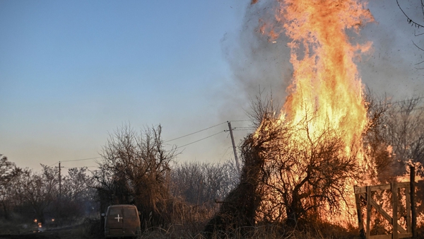 Trees burn after white phosphorus munitions exploded at the village of Chasiv Yar near Bakhmut