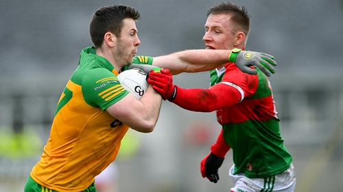 Donegal's Eoghan Bán Gallagher in possession against Mayo's Ryan O'Donoghue in last year's league clash. The sides meet in Ballybofey on Sunday with the home side in desperate need of a win