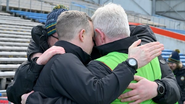 Offaly manager Martin Murphy, in the green vest, and his selectors take a moment to remember Liam Kearns after the game