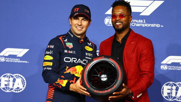 Sergio Perez was presented with the Pirelli Pole Position trophy by former Manchester United footballer Patrice Evra