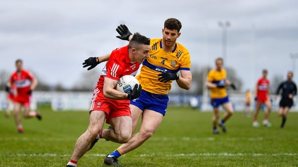 Niall Toner of Derry in action against Ronan Lanigan of Clare