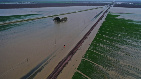 Flooded roads and farmland along the border of Kings County and Tulare County in California
