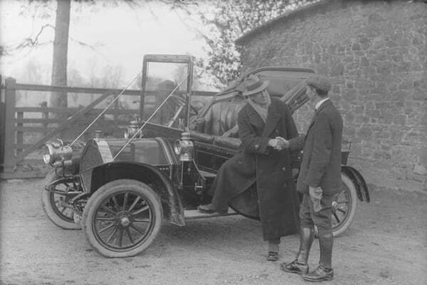 Century Ireland Issue 253 - Messrs Cooper, talking at motor car Photo: National Library of Ireland, POOLEWP 2373