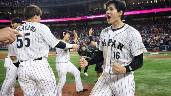 Shohei Ohtani (R) celebrates with his team-mates after Japan won the 2023 World Baseball Classic