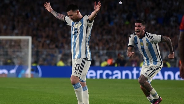 Lionel Messi (L) celebrates with Rodrigo De Paul (R) after scoring against Panama