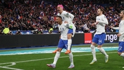 Antoine Griezmann celebrates with Kylian Mbappe after opening the scoring