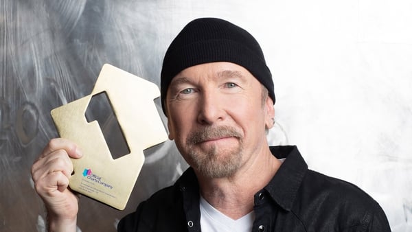 The Edge of U2 with his Official Number 1 Album Award for U2's Songs of Surrender. U2 have secured their 11th UK number one album with Songs Of Surrender, the Official Charts Company said. Picture credit: Emily Quinn
