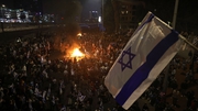 Protesters block a road during a rally against the Israeli government's judicial reform in Tel Aviv, Israel