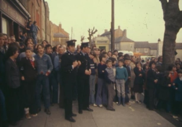 Chapelizod locals and Gardaí look on as the fire burns