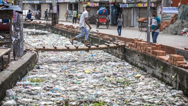 A canal in the Bangladesh capital, Dhaka, is blocked by piles of waste
