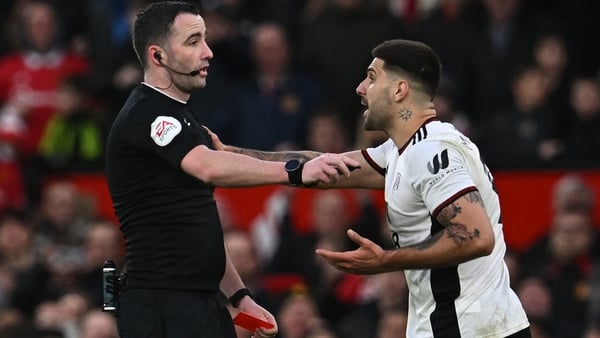 Chris Kavanagh (L) sent off Aleksandar Mitrovic for trying to grab him while complaining against a decision