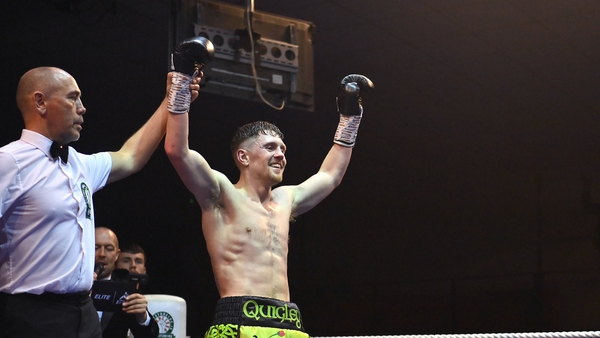 Quigley celebrates after defeating Gabor Gorbics in their super middleweight bout