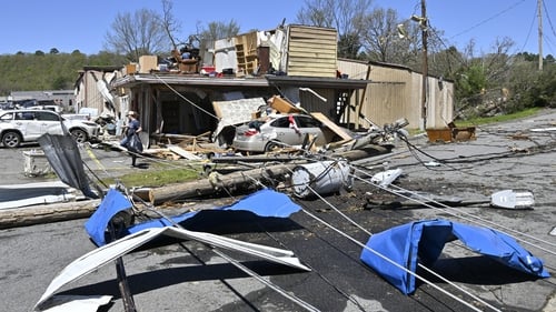 Residents clean up after the devastating tornadoes in Little Rock, Arkansas